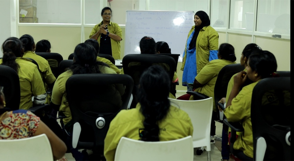 Women trainees in a classroom session during their EV driver training